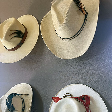 Assorted western hats in the Bougie Bison Mercantile store at Rebel Ranch.